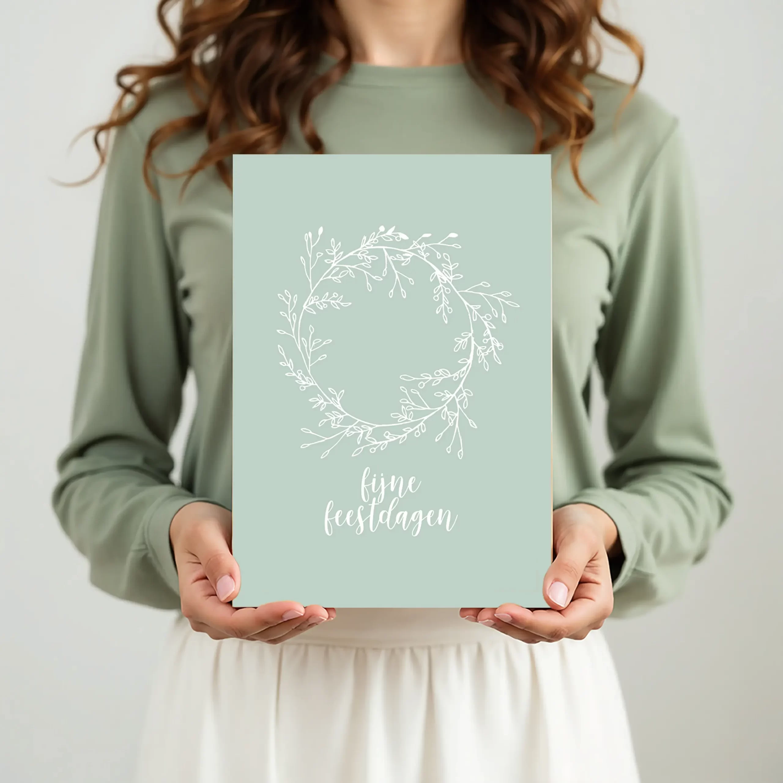 kerstkaart met mintgroene krans in hand, BIO TOP-papier