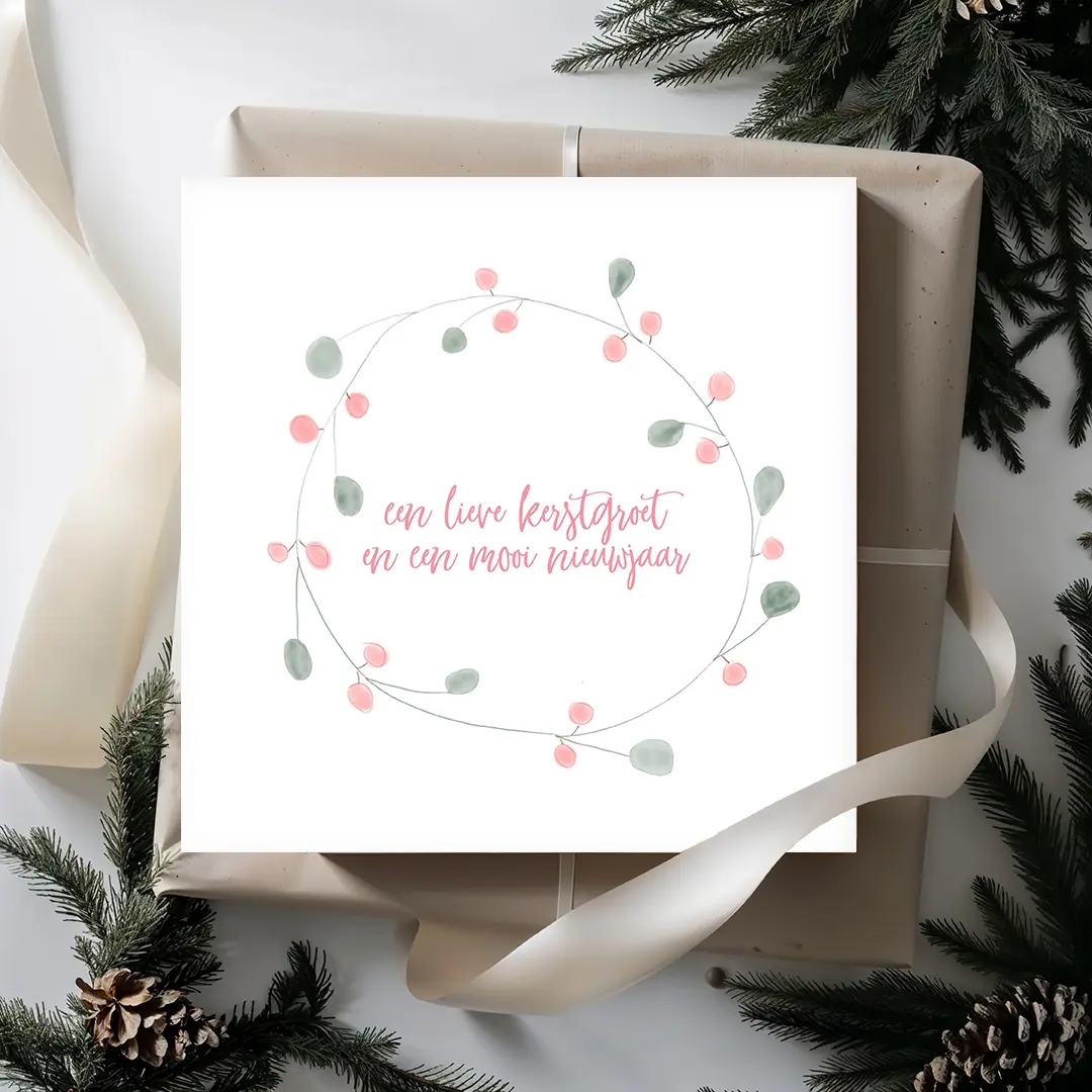 Kerstkaart in pasteltinten met zachte kerstkrans illustratie en subtiele kerstwens – duurzame kerstkaart Grafiquelien